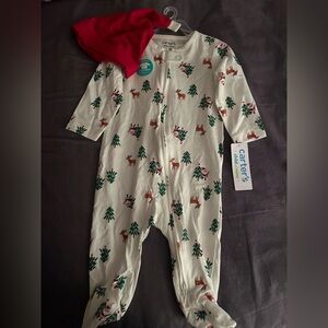 Brand new Carter's Christmas footed pajamas with hat. 3-6 mos